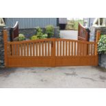 Pair of PVC electric gates with steel posts, motors and sensors