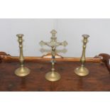 19th. C. brass crucifix and pair of brass candlesticks. {30 cm H x 29 cm W x 10 cm D}.