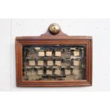 Servants bell board in mahogany and glass case Cox Walkers Darlington {47 cm H x 57 cm W x 8 cm D}.
