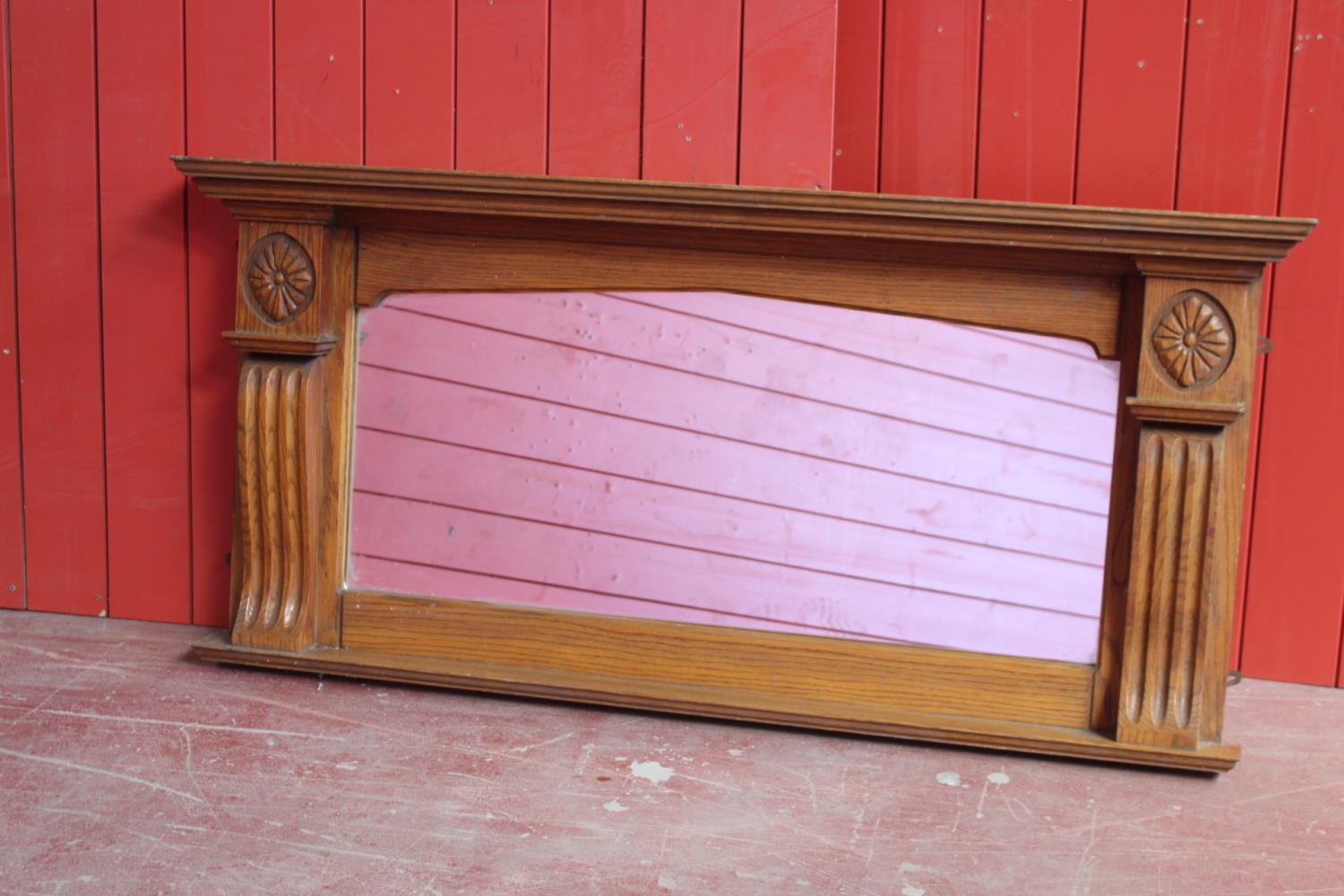 Decorative oak overmantle. {67 cm H x 137 cm W x 14 cm D}.