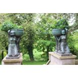 Pair of bronze urns each supported by two ladies in Grecian style {95 cm H x 102 cm W x 62cm D}