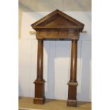Oak pediment mounted on two tapered pillars {330 cm H x 185 cm W x 87 cm D}