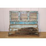 Painted wood stepped three door glass cabinet {125 cm H x 153 cm W x 62 cm D}.