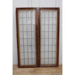 Pair of leaded stain glass windows {180 cm H x 63 cm W x 4 cm D}.