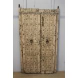 Pair of 18th C. pitch pine doors with heavy rivets {207 cm H x 113 cm W x 10 cm D}.