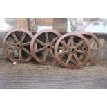 Set of four cast iron train wheels. {15 cm D x 70 cm Diam}.