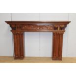 Carved fire surround with reeded pillars and Corinthian {133 cm H x 203 cm W x 45 cm D}