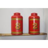 Pair of red metal tea bins {40 cm H x 22 cm Dia.}.