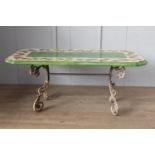 Handmade and hand painted ceramic table raised on cast iron base {79 cm H x 200 cm W x 92 cm D}.