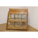 Unusual shop display cabinet with sliding glass doors {93 cm H}.