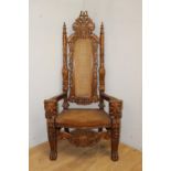 Decorative carved mahogany throne chair with lions masks and rattan seat and back {180 cm H x 92