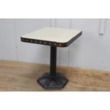 Cast iron studded table with metal top {75 cm H x 60 cm W x 70 cm D}.