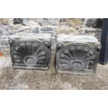 Pair of 19th. C. stone heads with scroll and shell design.{42 cm H x 52 cm W x 49 cm D}.