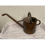 Copper watering can.