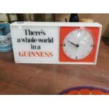 1950s There's A Whole World In A Guinness Perspex advertising clock {15 cm H x 32 cm W x 7 cm D}.