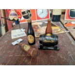 Two Guinness cork screws in the form of Guinness bottles and a Guinness barrel with bottle figure {