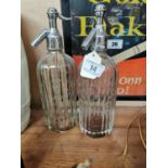 Two Thwaites mineral waters syphons. {32 cm H}.