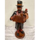 Figure of a musician {64 cm H}.