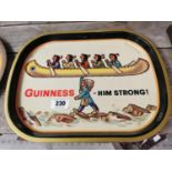Guinness Him Strong tin plate advertising drinks tray {32 cm H x 41 cm W}.