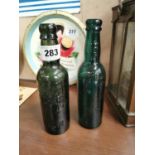Mount Joy brewery Dublin glass bottle and N. Carolan Dundalk glass advertising bottle {23 cm H x 6