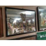 Guinness framed advertising mirror {50 cm H x 64 cm W}.