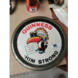 Guinness Him Strong tin plate advertising drinks tray {27 cm Dia.}.