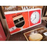 Perspex Guinness advertising shelf clock {14 cm H x 31 cm W x 5 cm D}.