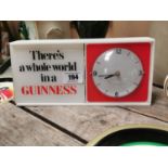 1950's There's A Whole World In A Guinness Perspex advertising clock {15 cm H x 32 cm W x 7 cm D}.