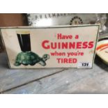 Have a Guinness when your tired celluloid advertising show card {14 cm H x 28 cm W}.