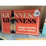 Guinness Guinness- Bigger bottle better value advertising show card {23 cm H x 36 cm W}.