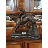 Bronze model of a jockey and horse mounted on marble base {35 cm H x 26 cm W x 33 cm D}.