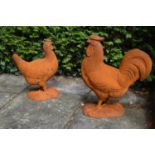 Two cast iron figures of a Rooster and Hen {47 cm H x 40 cm W}.