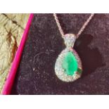 14ct. white gold pear shaped emerald and diamond pendant necklace Estimated: weight of diamonds 2.