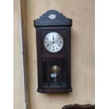 1930's oak wall clock with silvered dial. { 77cm H X 33cm W X 17cm D }.