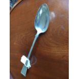 English silver basting spoon in the popular fiddle pattern. Weight 157 grams, 5 troy ounces.