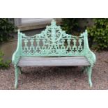 Decorative cast iron garden seat with wooden seat { 93cm H X 120cm W X 44cm D }.