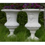 Pair large moulded stone urns decorated with ladies masks {132 cm H x 80 cm Dia.}.