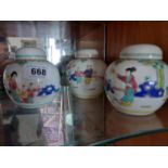 Three Oriental ceramic ginger jars {12 cm H x 12 cm Dia.}.