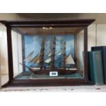 Model of a Sailing Ship mounted in a glazed case. { 34cm H X 45cm W X 22cm D }.