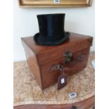 Early 20th C. leather bound hat box with original top hat {28 cm H x 43 cm W x 36 cm D}.