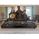 19th. C. mantle clock the bronze reclining figurine and dial mounted on a rouge marble base { 43cm H