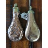 Two early 19th C. brass and copper powder flasks.