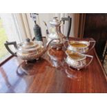 19th C. four piece silverplate tea service {25 cm H x 23 cm W to 10 cm H x 15 cm W}.