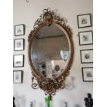 Exceptional quality 19th C. giltwood oval wall mirror with candelabras {164 cm H x 84 cm W}.