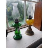 Two early 20th C. coloured glass and brass oil lamps {52 cm H and 49 cm H}.