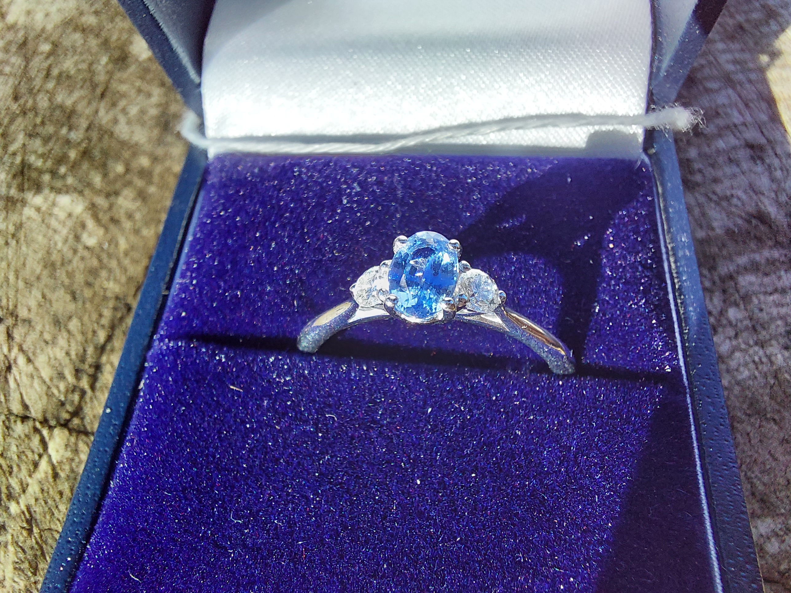 18ct. white gold tanzanite and diamond three stone ring Size: L