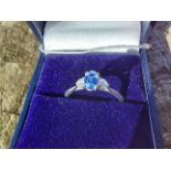 18ct. white gold tanzanite and diamond three stone ring Size: L