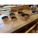 Set of five graduated copper and metal saucepans { 10cm H X 21cm Dia }.