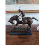 Bronze figure of Jockey on Horse mounted on marble base {33 cm H x 40 cm W x 13 cm D}.