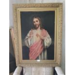 20th. C. The Sacred Heart oleograph mounted in a gilt frame { 88cm H X 66cm W }.